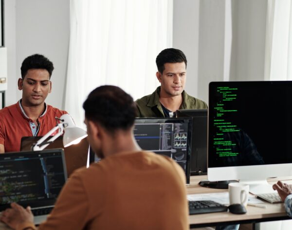 Devops Engineers Working in Office